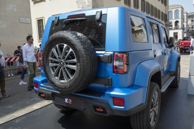 Rear view with mounted spare tire and LED tail lights on SUV