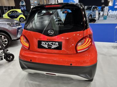 Rear view of a compact electric vehicle with modern tail lights and rear hatch design