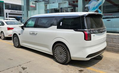 Side and rear view of modern electric MPV with distinctive rear lights and unique wheels.