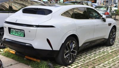 Rear and side profile of sleek electric SUV with modern alloy wheels.