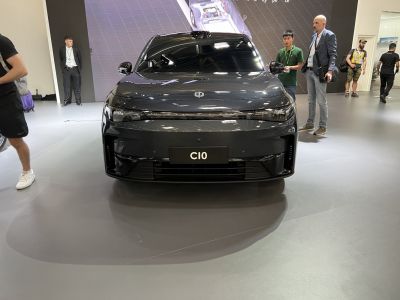 Front view of electric sedan with slim LED headlights and sleek aerodynamic design.