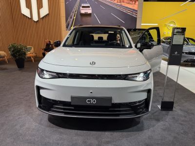 Front view with sleek LED headlights and distinctive grille