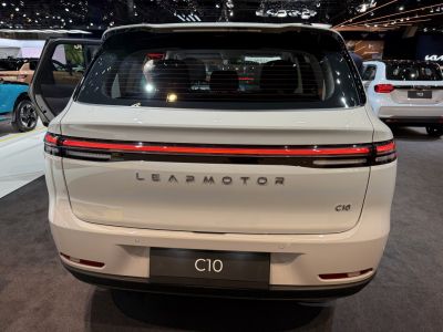 Rear view of a modern electric SUV with continuous LED tail light bar