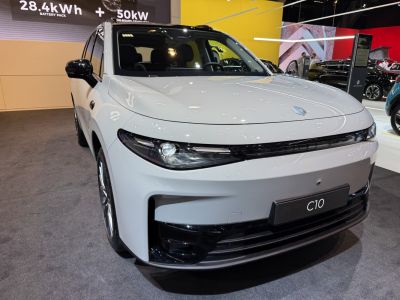 Sleek LED headlights and aerodynamic front bumper of an electric SUV