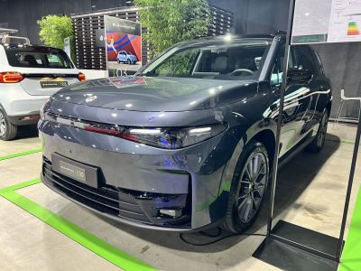 Front view of electric SUV with sleek LED headlights and aerodynamic body