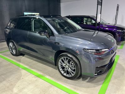 Front-side view with alloy wheels in showroom lighting
