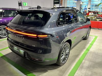 Rear view with full-width LED light bar and sporty alloy wheels.