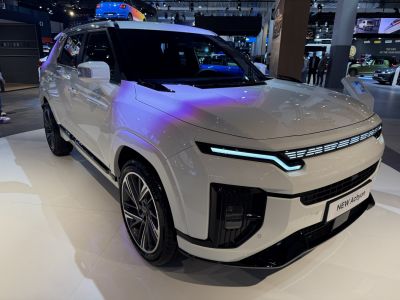 Front view of modern SUV with LED headlights and sharp lines