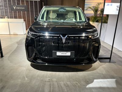 Bold grille and sleek LED headlights front view in showroom setting