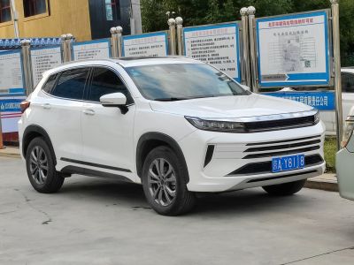 Front and side view of SUV with LED headlights and bold grille