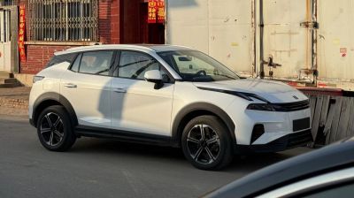 White compact SUV with black alloy wheels and futuristic front design