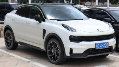 Front side view of SUV with black roof and white body