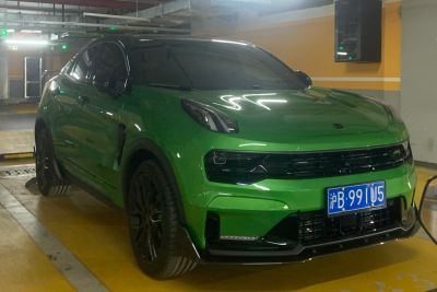 Green compact SUV with black accents and LED headlights