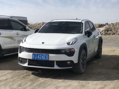 Front view of white SUV with distinctive headlights and grille design
