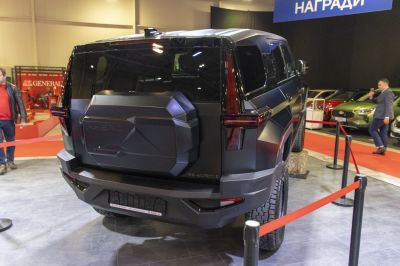 Rugged SUV rear with spare tire cover and bold tail lights