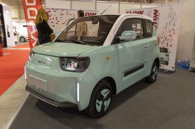 Compact electric city vehicle with LED headlights and unique wheels