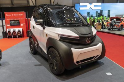 Compact electric nanocar with futuristic front design and LED lighting