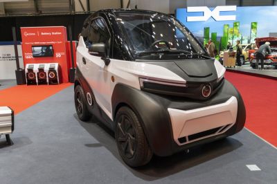 Compact electric urban vehicle, two-tone design, futuristic LED lighting