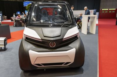 Compact electric nanocar front view with wide windshield and sleek design
