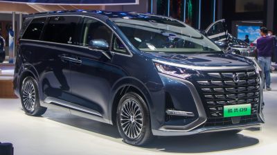 Futuristic front grille and sharp LED headlights on a sleek MPV.