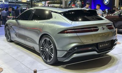 Aerodynamic modern electric sedan rear and side with alloy wheels