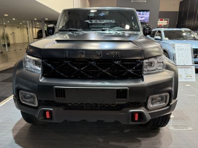 Front view with distinctive grille and modern headlights.