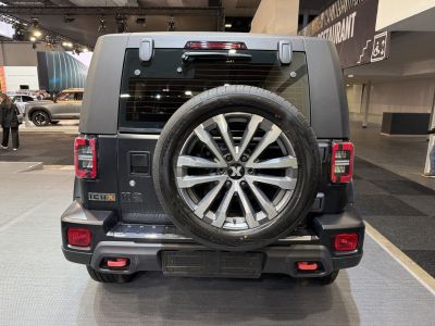 Rear view with mounted spare wheel and modern tail lights