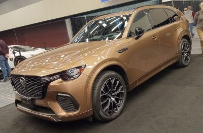 Prominent front grille and stylish alloy wheels of an SUV