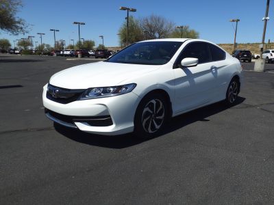 Aerodynamic front and side view with modern headlights and alloy wheels