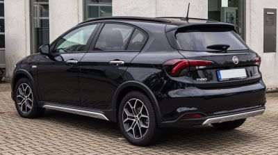 Rear side view of sleek hatchback with modern tail lights and alloy wheels