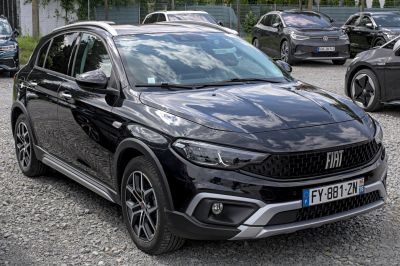 Front-side view with modern grille, alloy wheels, fog lights