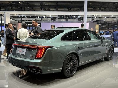 Facelift luxury sedan rear view with LED tail lights and dual exhaust tips