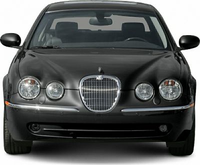 Front view with chrome grille and quad round headlights