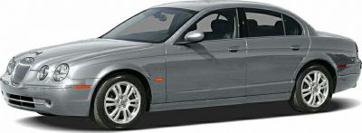 Silver luxury sedan with distinctive front grille and alloy wheels.
