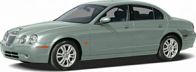 Side view of Jaguar S-type CCX sedan with round headlights and smooth body.