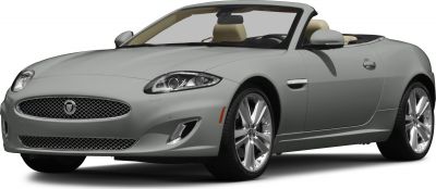 Convertible luxury sports car with distinctive headlights and open top.