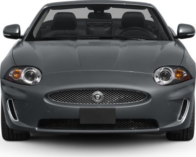 Front grille and headlamps of a luxury convertible roadster.