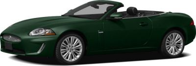 Dark green two-door luxury convertible with sleek design and alloy wheels