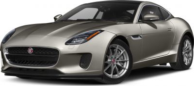 Front angle showing sleek headlights and large grille of a sports coupe