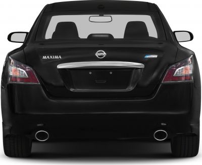 Dual exhaust pipes and rear taillights of a sedan