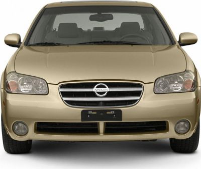 Front view of sedan with grille, headlights, and fog lights.