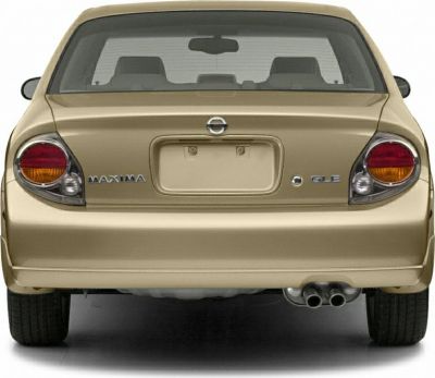 Rear view of sedan with distinctive round tail lights and dual exhaust pipes