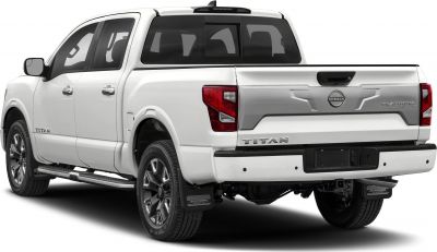 Rear and side view of a white crew cab pickup with alloy wheels