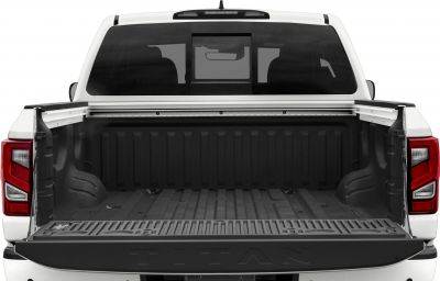 Open truck bed with tailgate down and visible rear window.