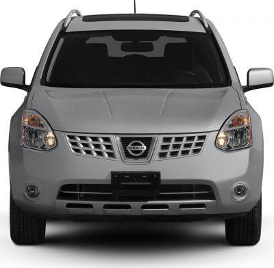 Front grille with Nissan badge, dual headlights, chrome roof rails