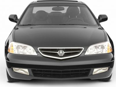 Front view of vehicle with distinctive headlights, grille, and fog lights.