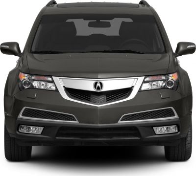 Front view showing chrome grille, headlights, and roof rails.