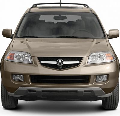 Front view with distinctive headlights, grille, and roof rack