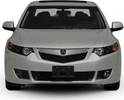 Car front with sharp headlights and a distinctive grille
