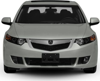 Front view with headlights, grille, and fog lights